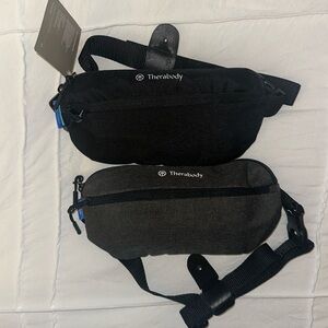 2 Therabody crossbody bags with travel products - one black and one gray - New